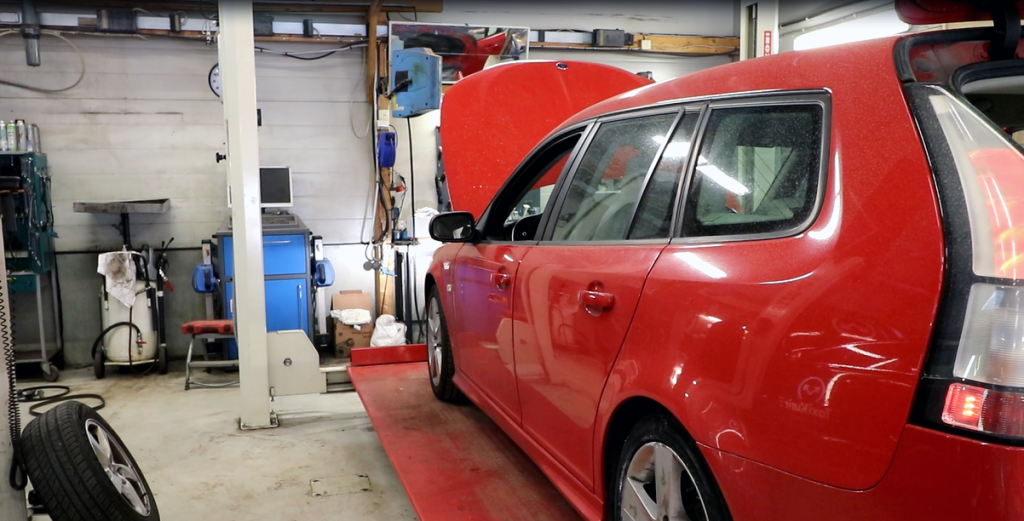 Red Saab 9-3 in workshop