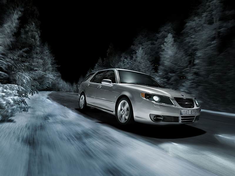 Saab drives through the winter night